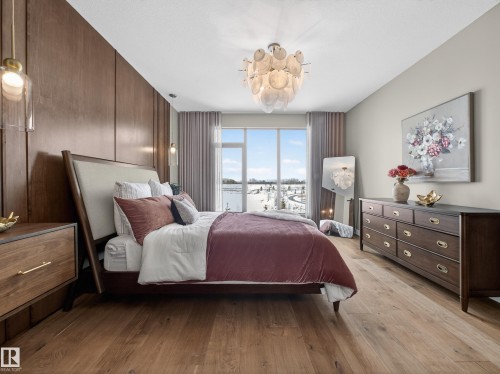 Bedroom with light wood-style flooring - 7104 54 Avenue, Beaumont, AB - Indoor Photo Showing Bedroom