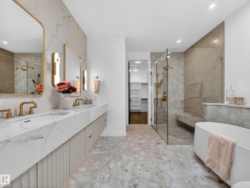 Bathroom featuring a walk in closet, a shower stall, a freestanding bath, double vanity, and recessed lighting - 7104 54 Avenue, Beaumont, AB - Indoor Photo Showing Bathroom