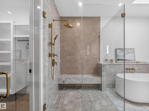 Full bathroom featuring a soaking tub, a shower stall, recessed lighting, and tile walls - 7104 54 Avenue, Beaumont, AB - Indoor Photo Showing Bathroom