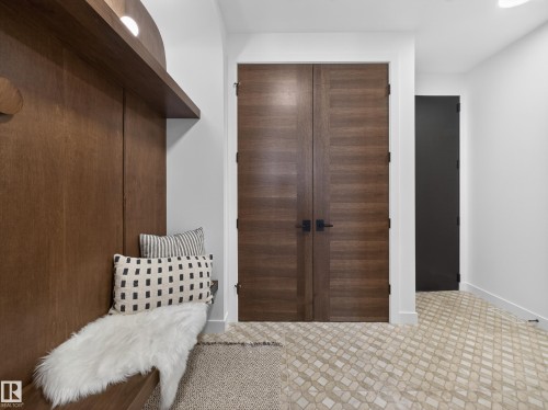 Mudroom with baseboards and light flooring - 7104 54 Avenue, Beaumont, AB - Indoor Photo Showing Other Room