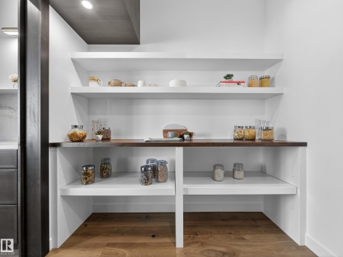 Detailed view of wood finished floors - 7104 54 Avenue, Beaumont, AB - Indoor With Storage