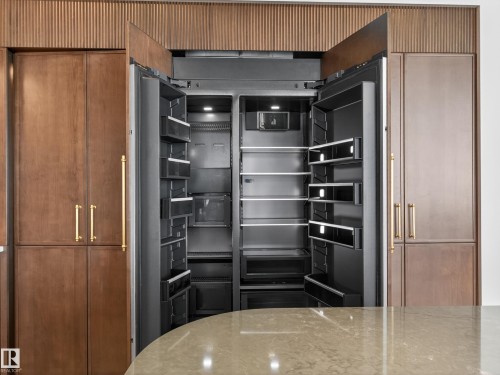 Kitchen with paneled built in fridge - 7104 54 Avenue, Beaumont, AB - Indoor Photo Showing Kitchen