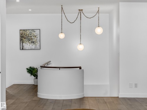 Reception area with recessed lighting - 7104 54 Avenue, Beaumont, AB - Indoor Photo Showing Other Room