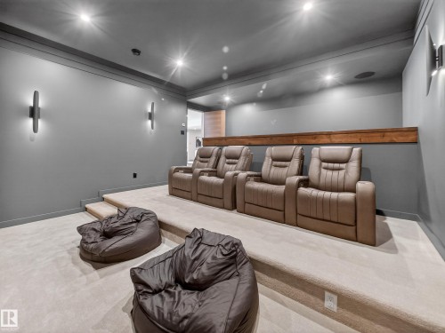 Carpeted home theater with recessed lighting and baseboards - 7104 54 Avenue, Beaumont, AB - Indoor