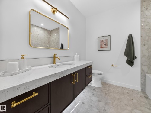 Bathroom with vanity and a bathtub - 7104 54 Avenue, Beaumont, AB - Indoor Photo Showing Bathroom