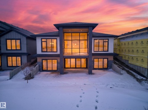 Snow covered back of property featuring roof with shingles - 7104 54 Avenue, Beaumont, AB - Outdoor