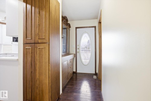 Doorway featuring hardwood / wood-style flooring and baseboards - 83 Bellevue Crescent, St. Albert, AB - Indoor Photo Showing Other Room