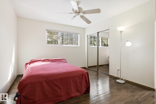Bedroom featuring dark wood finished floors, ceiling fan, and a closet - 83 Bellevue Crescent, St. Albert, AB - Indoor Photo Showing Bedroom