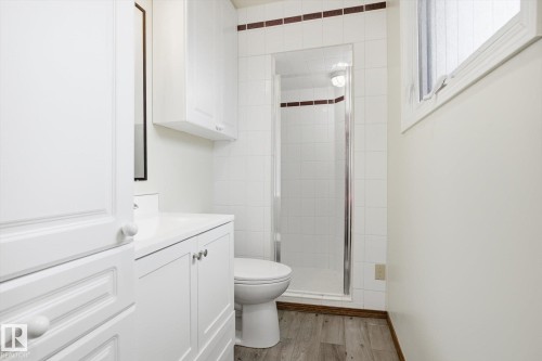 Full bathroom featuring a shower stall, vanity, and light wood-style flooring - 83 Bellevue Crescent, St. Albert, AB - Indoor Photo Showing Bathroom