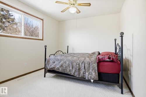 Bedroom featuring light colored carpet and a ceiling fan - 83 Bellevue Crescent, St. Albert, AB - Indoor Photo Showing Bedroom