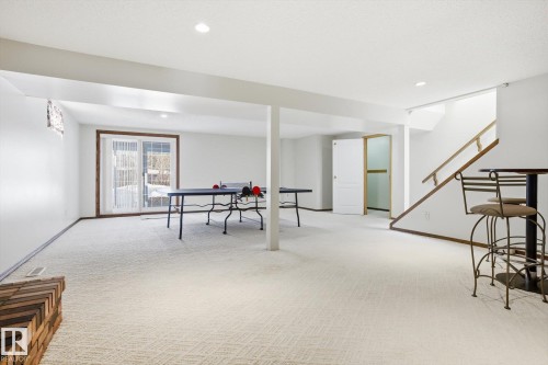 Rec room with light carpet and recessed lighting - 83 Bellevue Crescent, St. Albert, AB - Indoor Photo Showing Other Room