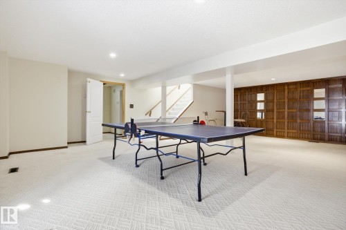 Game room with light carpet, recessed lighting, and wood walls - 83 Bellevue Crescent, St. Albert, AB - Indoor Photo Showing Other Room