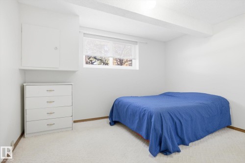 Bedroom with light carpet and beamed ceiling - 83 Bellevue Crescent, St. Albert, AB - Indoor Photo Showing Bedroom