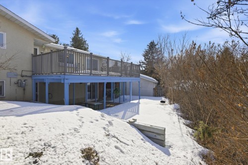 Snow covered rear of property with a deck and stucco siding - 83 Bellevue Crescent, St. Albert, AB - Outdoor