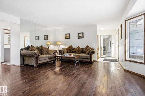 Living room with dark wood-type flooring - 83 Bellevue Crescent, St. Albert, AB - Indoor Photo Showing Living Room