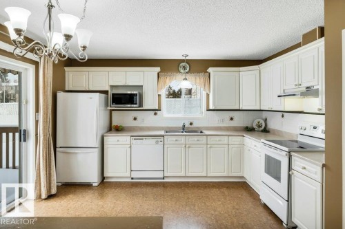 8146 27 Avenue, Edmonton, AB - Indoor Photo Showing Kitchen With Double Sink