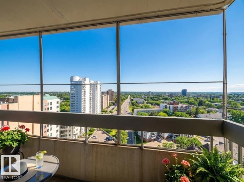 Balcony featuring a view of city and a sunroom - 1401 10883 Saskatchewan Drive, Edmonton, AB -  With View