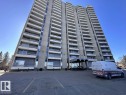 View of apartment building / complex featuring uncovered parking - 1401 10883 Saskatchewan Drive, Edmonton, AB  - Outdoor With Facade 