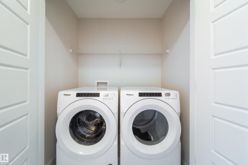 Laundry area featuring washer and dryer - 112 Stonehouse Way, Leduc, AB - Indoor Photo Showing Laundry Room
