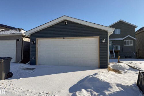 View of front of property with a garage - 112 Stonehouse Way, Leduc, AB - Outdoor