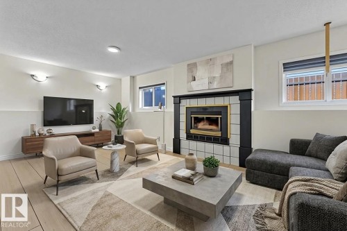 2536 35 Street, Edmonton, AB - Indoor Photo Showing Living Room With Fireplace
