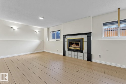 2536 35 Street, Edmonton, AB - Indoor Photo Showing Other Room With Fireplace