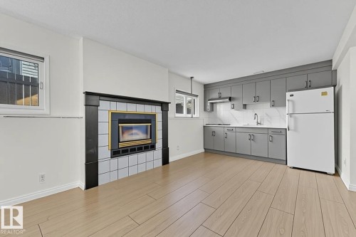 2536 35 Street, Edmonton, AB - Indoor Photo Showing Other Room With Fireplace