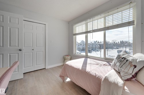 Bedroom featuring a closet and light wood-style floors - 21 6032 38 Avenue, Edmonton, AB - Indoor Photo Showing Bedroom