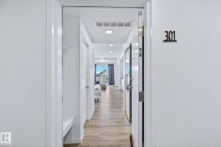 Hallway featuring recessed lighting and light wood-style flooring - 
