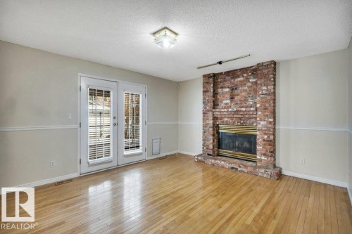 20 Alphonse Crest, St. Albert, AB - Indoor Photo Showing Living Room With Fireplace