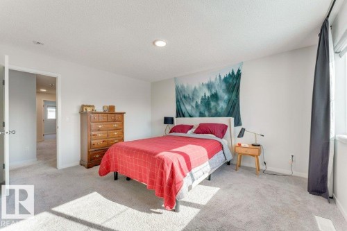 Bedroom with light carpet, recessed lighting, and a textured ceiling - 1323 South Creek Link, Stony Plain, AB - Indoor Photo Showing Bedroom