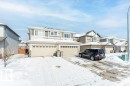 View of front of home featuring a garage and a residential view - 1323 South Creek Link, Stony Plain, AB  - Outdoor 