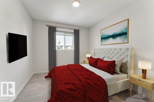 Bedroom with light colored carpet and a textured ceiling - 1323 South Creek Link, Stony Plain, AB - Indoor Photo Showing Bedroom