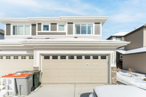 Garage featuring concrete driveway - 1323 South Creek Link, Stony Plain, AB - Outdoor With Exterior