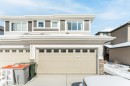 Garage featuring concrete driveway - 1323 South Creek Link, Stony Plain, AB  - Outdoor With Exterior 