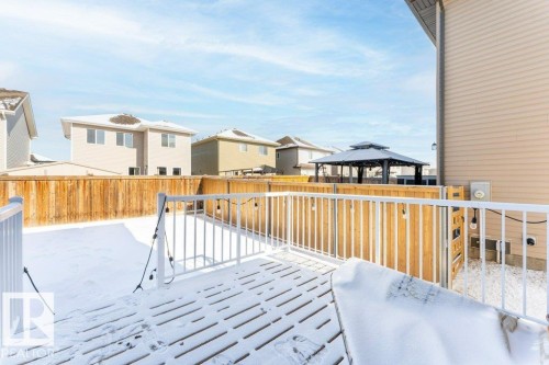 Wooden terrace with a residential view, a gazebo, and a fenced backyard - 1323 South Creek Link, Stony Plain, AB - Outdoor With Exterior