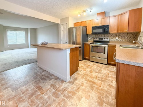 Edmonton, AB - Indoor Photo Showing Kitchen With Double Sink