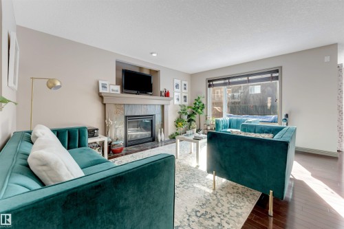 12063 21 Avenue Sw, Edmonton, AB - Indoor Photo Showing Living Room With Fireplace