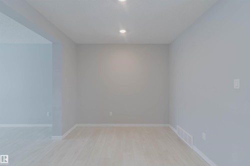 Room featuring light-colored flooring, recessed lighting, and light gray walls - 326 Desrochers Boulevard, Edmonton, AB - Indoor Photo Showing Other Room