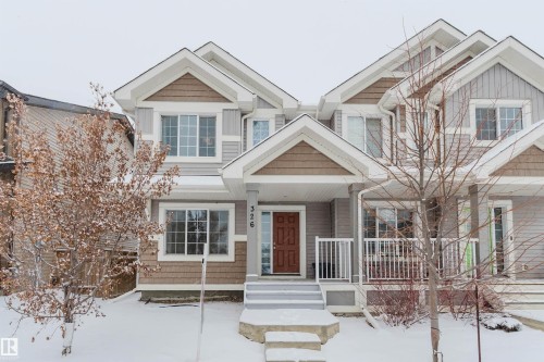 The property features a multi-level facade with horizontal siding and shake accents - 326 Desrochers Boulevard, Edmonton, AB - Outdoor With Facade