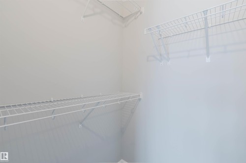 Storage area with white wire shelving units installed on the walls - 326 Desrochers Boulevard, Edmonton, AB - Indoor With Storage