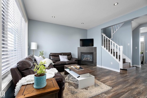 34 Spruce Boulevard, Leduc, AB - Indoor Photo Showing Living Room With Fireplace