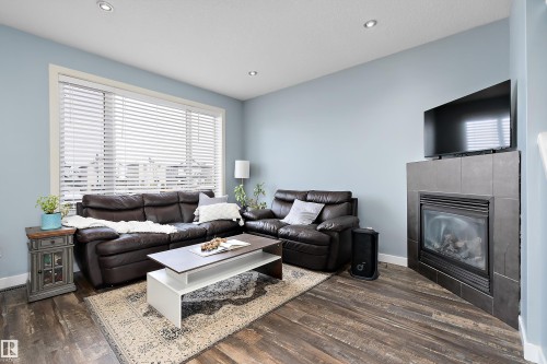 34 Spruce Boulevard, Leduc, AB - Indoor Photo Showing Living Room With Fireplace