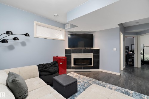 34 Spruce Boulevard, Leduc, AB - Indoor Photo Showing Living Room With Fireplace