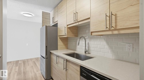 406 12121 Jasper Avenue, Edmonton, AB - Indoor Photo Showing Kitchen With Upgraded Kitchen