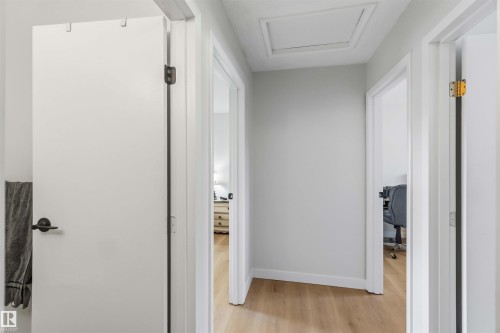 Hall with light wood finished floors and a desk - 4615 49 Avenue, Redwater, AB - Indoor Photo Showing Other Room