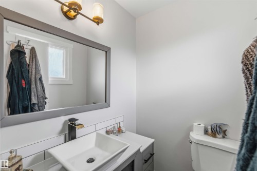 Bathroom with vanity and backsplash - 4615 49 Avenue, Redwater, AB - Indoor Photo Showing Bathroom