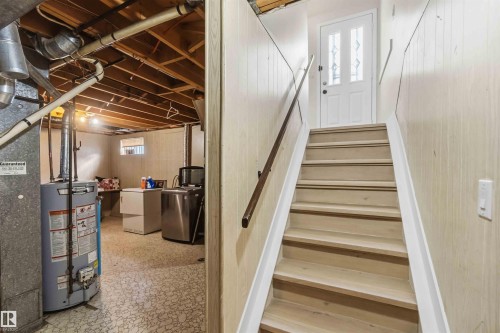 Stairway with gas water heater and washer / clothes dryer - 4615 49 Avenue, Redwater, AB - Indoor