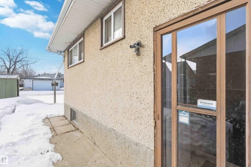 View of property exterior with stucco siding and an outbuilding - 4615 49 Avenue, Redwater, AB - Outdoor With Exterior