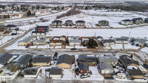 Snowy aerial view with a residential view - 4615 49 Avenue, Redwater, AB - Outdoor With View